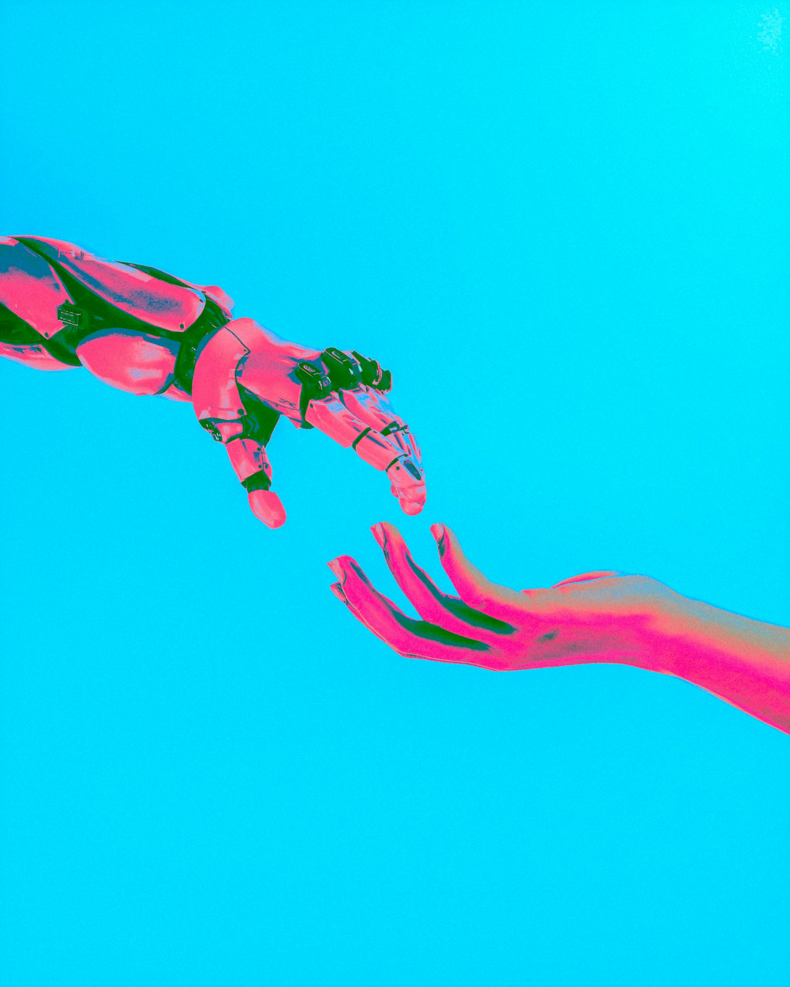 Robot and human hands reaching toward each other, symbolizing AI-assisted content authoring